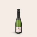 Green champagne bottle with a personalized label featuring "Tom & Anna Still Sparkling Since 1985" for any occasion