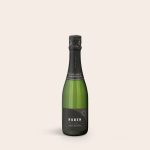 Green champagne bottle with a personalized label printed with the name Ruben and Happy Birthday text