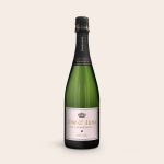 Green bottle of champagne with a personalized label featuring "Tom & Anna" and "Since 1985."