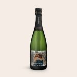 Green champagne bottle with a personalized label, printed with a photo of a couple and "Merry Christmas" text.