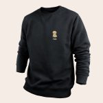 Black personal sweater with a custom printed tan cartoon dog and the name Leo underneath