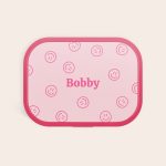 Pink personalized Mepal lunchbox with "Bobby" and smileys printed on the lid. Their name makes lunchtime special.