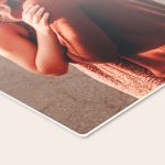 A ChromaLuxe aluminum photo frame printed with a customizable photo of a woman in a reddish-brown sweater