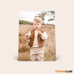 ChromaLuxe aluminum photo frame printed with a customizable picture of a child in a field holding a flower