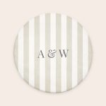 Round personalised bath mat with printed tan and white stripes and custom text A & W