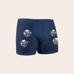 Navy blue boxer shorts printed with multiple circular photos of three boys to create boxer shorts that are as unique as he is