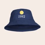 Navy personalized bucket hat printed with a yellow smiley face and the text 1982.