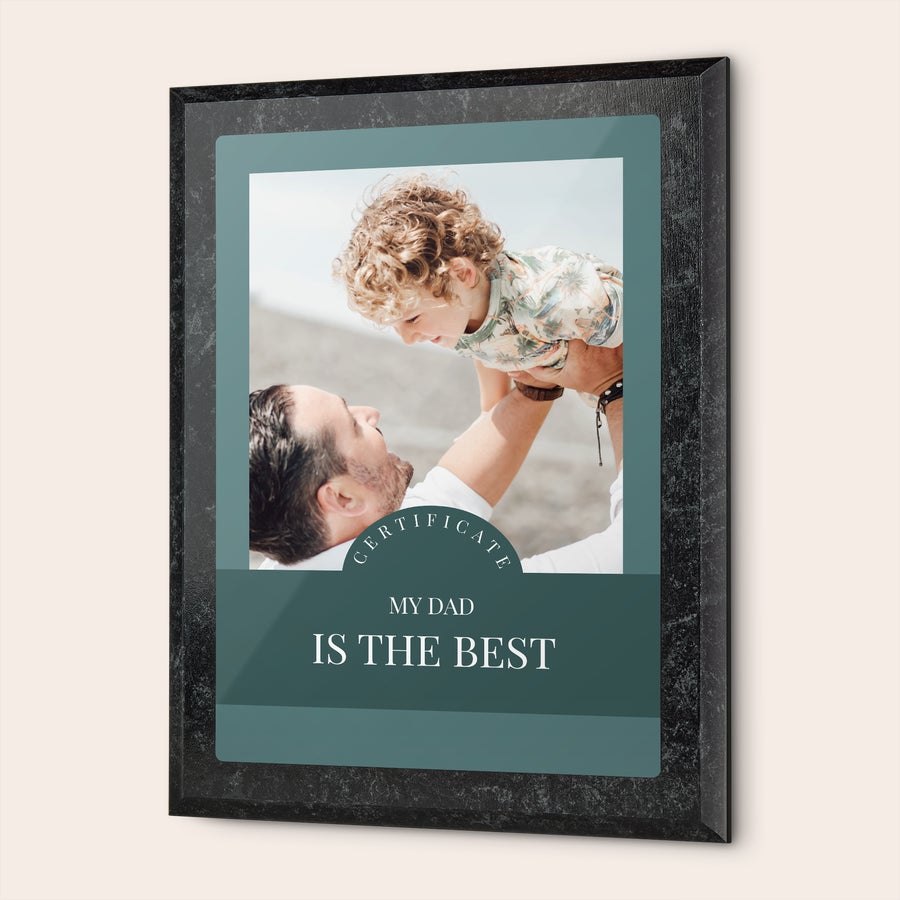 Black marble look certificate for best dads, printed with a personalized photo of a dad holding his child and text My Dad Is The Best