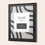 A personalized Best Dad certificate in a black frame, printed with "David, Dad of the year 2022" and a loving message.