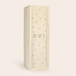 Moet & Chandon champagne in a light wooden case engraved with R & L and heart patterns