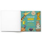 Open children's book with name, showing a personalized page for celebrating being 2 with various animals