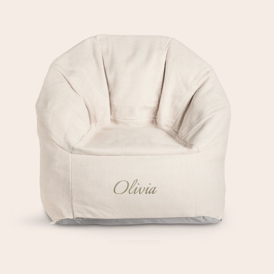 Personalized cream children's chair embroidered with the name Olivia. What child wouldnt be happy with such a cool trendy chair