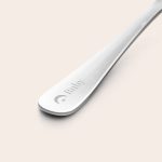 Close-up of a silver children's cutlery set with the name Ruby and a star and moon engraved