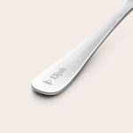 Close-up of a silver children's engraved cutlery set with the name Elijah and a teddy bear icon