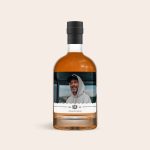 Bottle of dark rum with a personalized label, printed with a photo of a smiling man. The label also says No 45 Premium Drink.