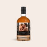 Dark rum bottle with a personalised label printed with a photo of a couple and "Happy Birthday Jasper"