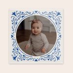 Personal ceramic tile with blue border, printed with a photo of a baby and space for a proverb.