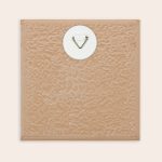Back of a personalized ceramic tile with a hanging hook to display a custom picture and proverb