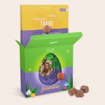 Personalized Easter Milka 3D gift box with a printed photo and the name Jasmine, next to flower-shaped chocolates.