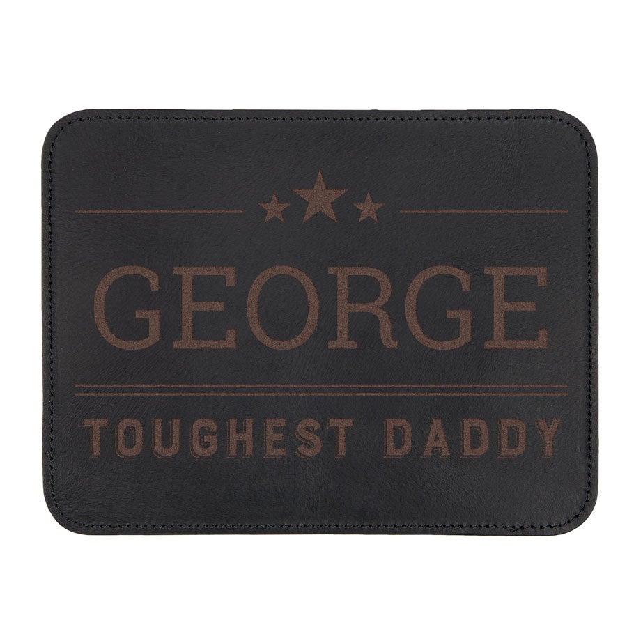 Black leather mousepad with George Toughest Daddy text and stars, engraved with a name