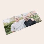 Personalised mouse mat printed with a photo of two smiling men for gaming enthusiasts