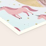 Printed unicorn blanket with pink unicorns and gold stars, a personalized gift.
