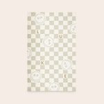 Personalised play mat 75 x 122 cm with a beige checkerboard pattern and the printed name Luke