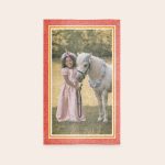 Personalised play mat - 75 x 122 cm printed with a photo of a girl in a pink dress and a unicorn-themed headband next to a white pony.