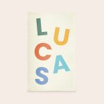 Personalised play mat - 75 x 122 cm with the name LUCAS printed in colorful letters.