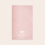 A pink personalised play mat - 75 x 122 cm, featuring the Childcare inc. logo and the name Beth printed in white.