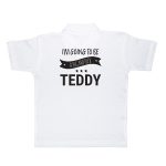 White polo shirt printed with "I'm going to be a big brother" and the personalized name Teddy