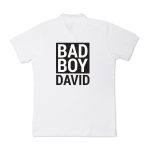 White personalized polo shirt printed with "BAD BOY DAVID" in black text
