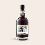Graham's 10 Year Old Tawny Port bottle with a custom photo label featuring two people and a dog, and the text "For the loveliest Mum" printed below the photo.