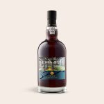 Graham's 20 Years port bottle with a personalized photo label showing a gym interior and text Cheers! A New Location!