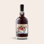 A bottle of Graham's The Tawny Reserve with a photo label featuring a family and the text "Happy holidays!"