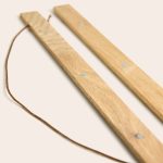 Magnetic poster hanger made of oak wood with a brown rope loop to hang your photo moment on the wall