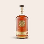 Bacardi Reserva Diez rum bottle with gold and red label, in an engraved wooden case with personalized text
