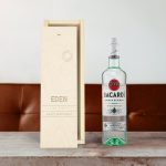 Bacardi white rum bottle next to an open personalized wooden case, engraved with the name Eden and the text Happy Birthday.