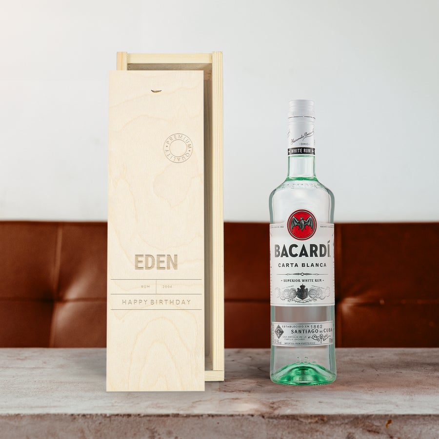 Bacardi white rum bottle next to an open personalized wooden case, engraved with the name Eden and the text Happy Birthday.
