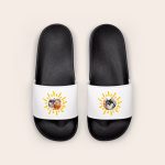 White personalised sliders with black soles, custom printed with a photo of a person and a dog, surrounded by a yellow sun design.