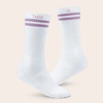 White personalized sports socks with lilac stripes, one printed with Taylor and the other with 15
