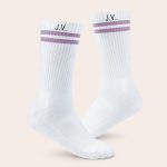 White personalized sports socks with lilac stripes, printed with the initials JV on each sock.