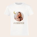 White t-shirt for pregnancy announcement, printed with a photo of a mother and child, and #1 Sister text