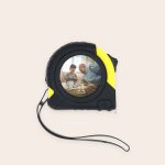 Black and yellow tape measure with a photo of a man and child printed on the front, customized for Measure Twice, Personalise Once