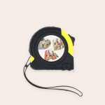 Black and yellow tape measure with a custom photo printed on a white circle for a unique personalised gift. Measure Twice, Personalise Once.