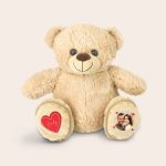 Personalised teddy bear with cool feet pockets printed with a photo and the name Emily