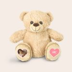 Personalized teddy bear with cool feet pockets printed with a baby photo and the name Lily