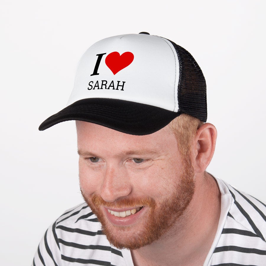 Black and white trucker cap printed with I heart Sarah design