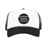 White and black trucker cap printed with the name Jamal in a black circle design