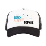 White and black trucker cap printed with "Eat Beach Sleep Repeat" and the personalized name Sophie